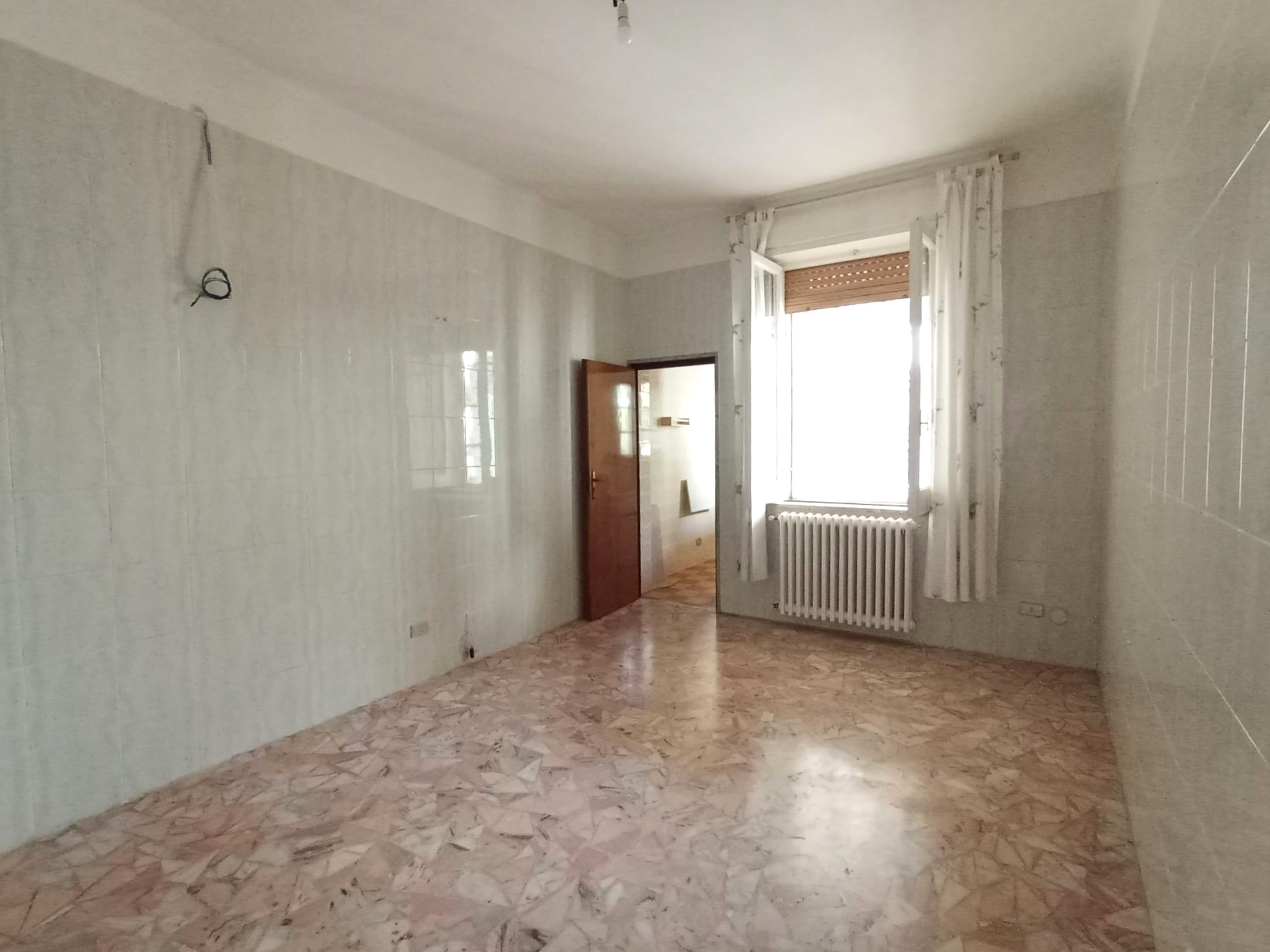 TRILOCALE CON GIARDINO PRIVATO